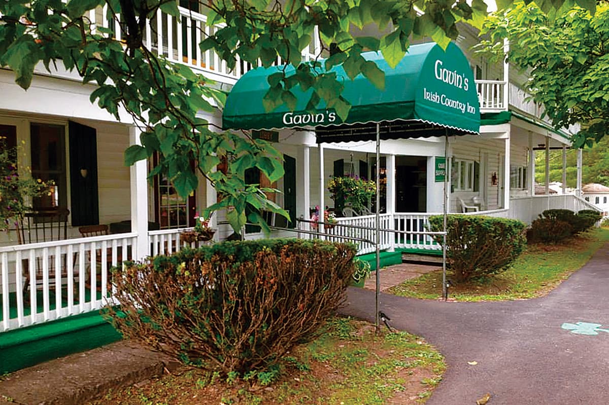 The green Gavin's Irish Country Inn awning over the front entrance on Golden Hill Road