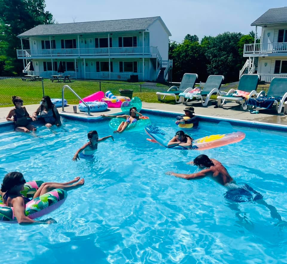 Kids and families playing with pool floats in the heated pool at Gavin's Irish Country Inn