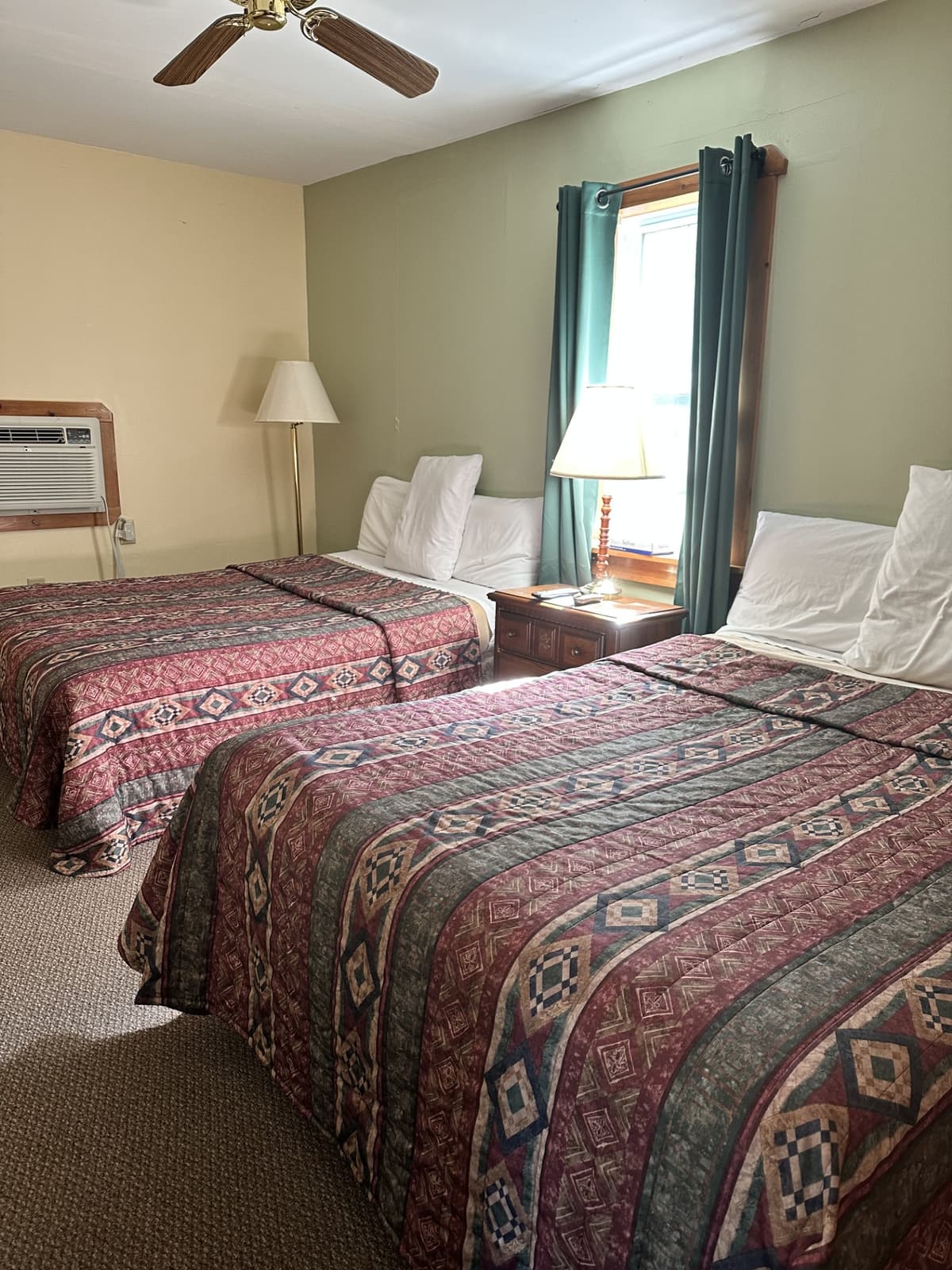 Cottage unit bedroom with two double beds at Gavin's